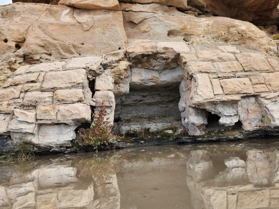 Kirena Tsosie photo of a rock fall reflected in water