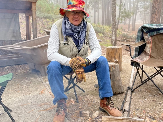 Josh Ruddick sitting by fire