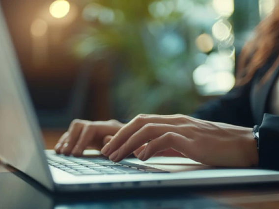 student job posting photo of person at laptop