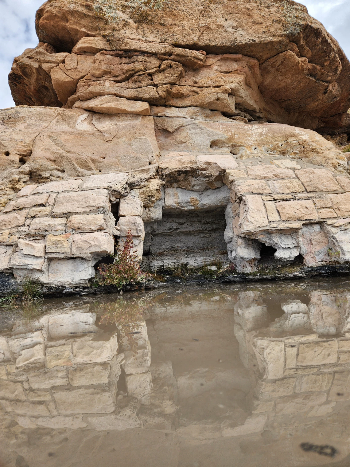 Kirena Tsosie photo of a rock fall reflected in water