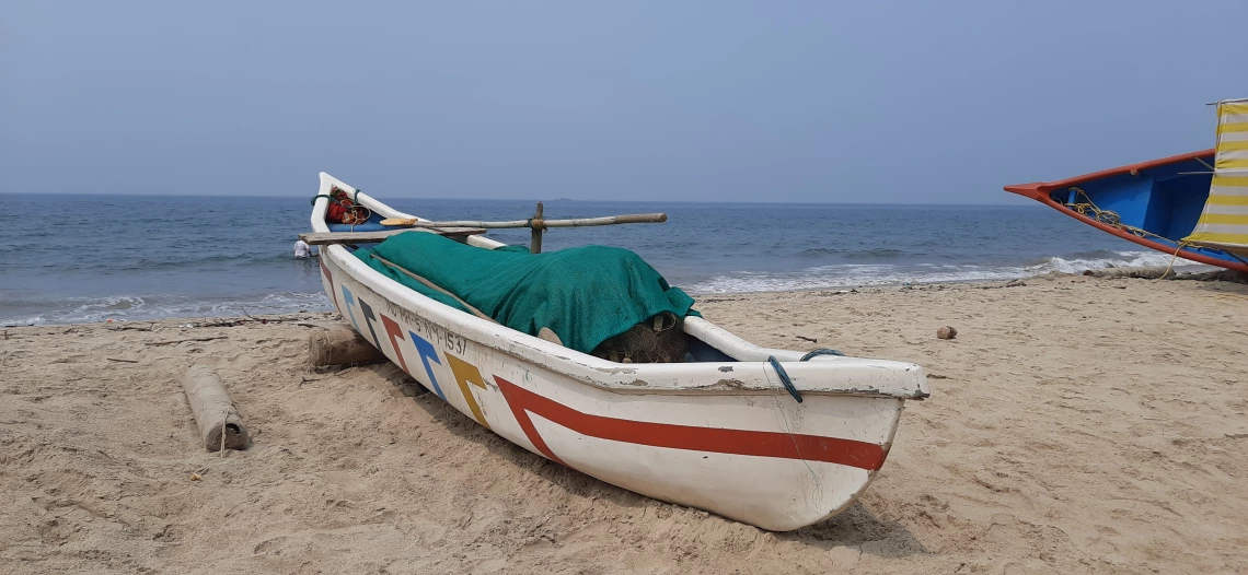 Channa Ganesh photo showing Devebag Beach with a boat on the edge