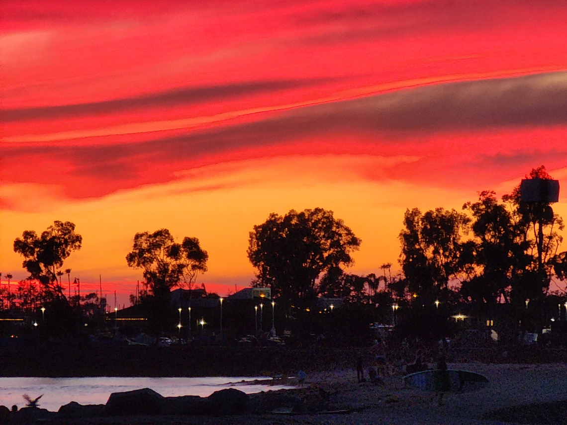 Stephen Poe; Sunset surfing at Doheny State Beach, CA