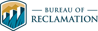 Bureau of Reclamation logo featuring a graphic of a dam and mountain