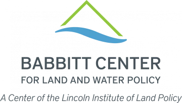 babbitt center logo - blue water streak with abstract green peak over it